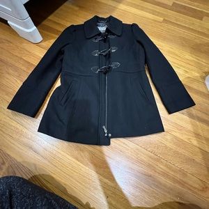 GUESS black coat with a zipper, but also buttons to clasp